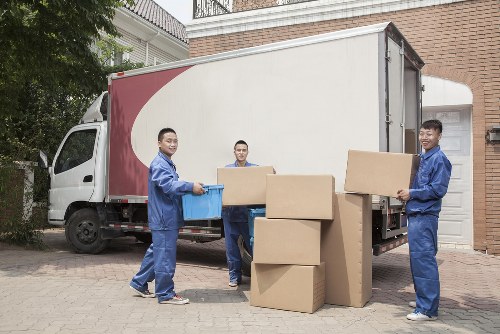 Removal van and movers outside a Forest Gate terrace house