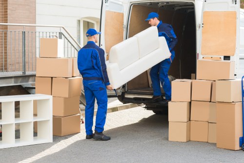 Office furniture and boxes being loaded for a commercial relocation