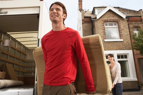Furniture being carefully moved from a flat in Forest Gate