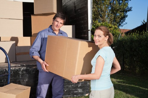 Loading boxes and furniture into a removal van